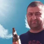 obito beja garrafa de cerveja